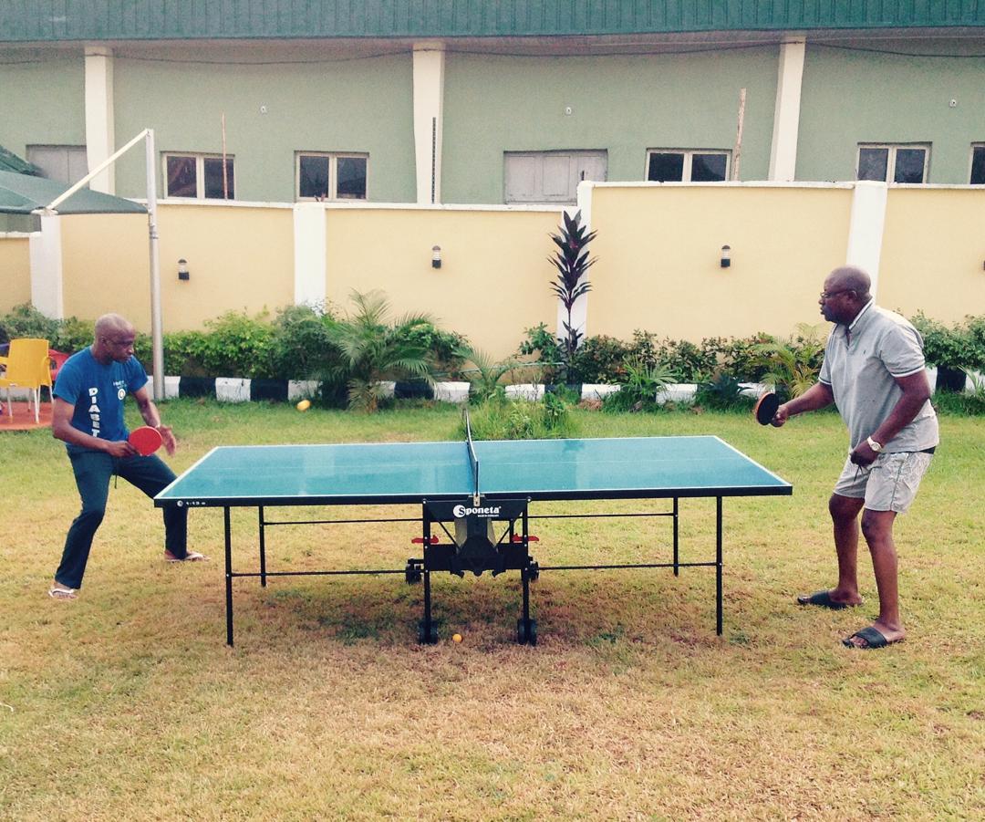 Guests playing table tennis on the K Yellow Hotel garden lawn